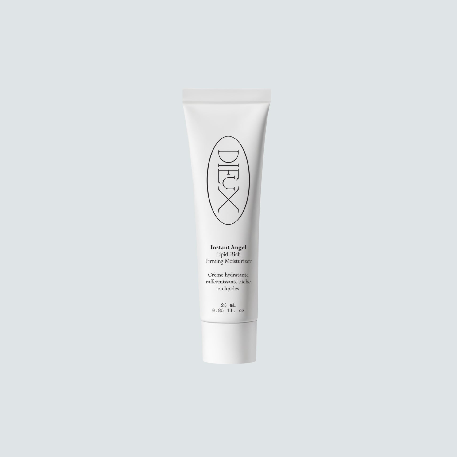 Dieux Instant Angel moisturizer tube on a pale background