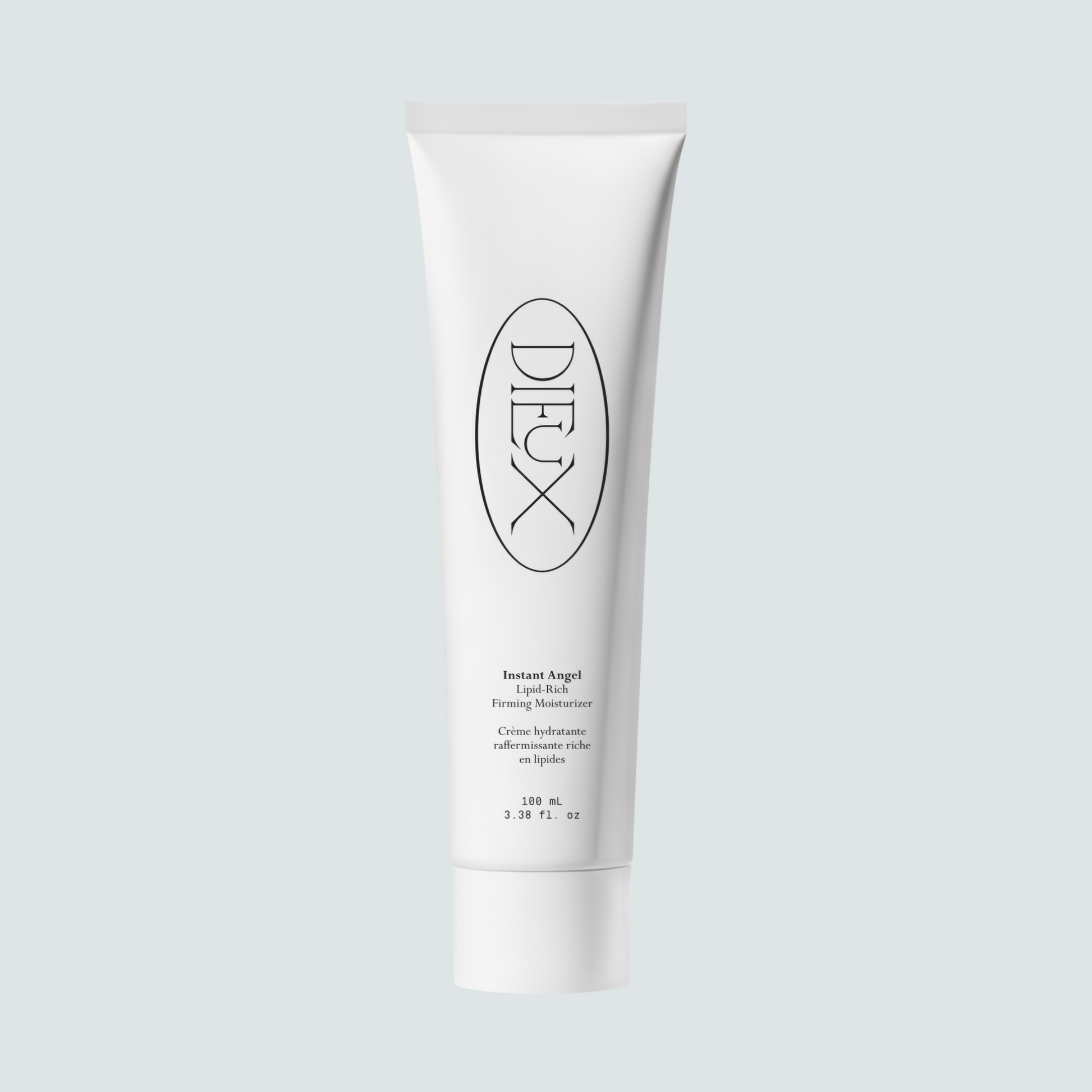 Dieux Instant Angel 100 ml moisturizer tube on a pale background