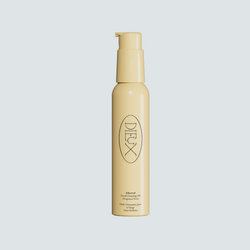 Dieux Ethereal Cleansing Oil bottle on a pale background