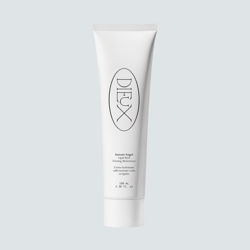 Dieux Instant Angel 100 ml moisturizer tube on a pale background