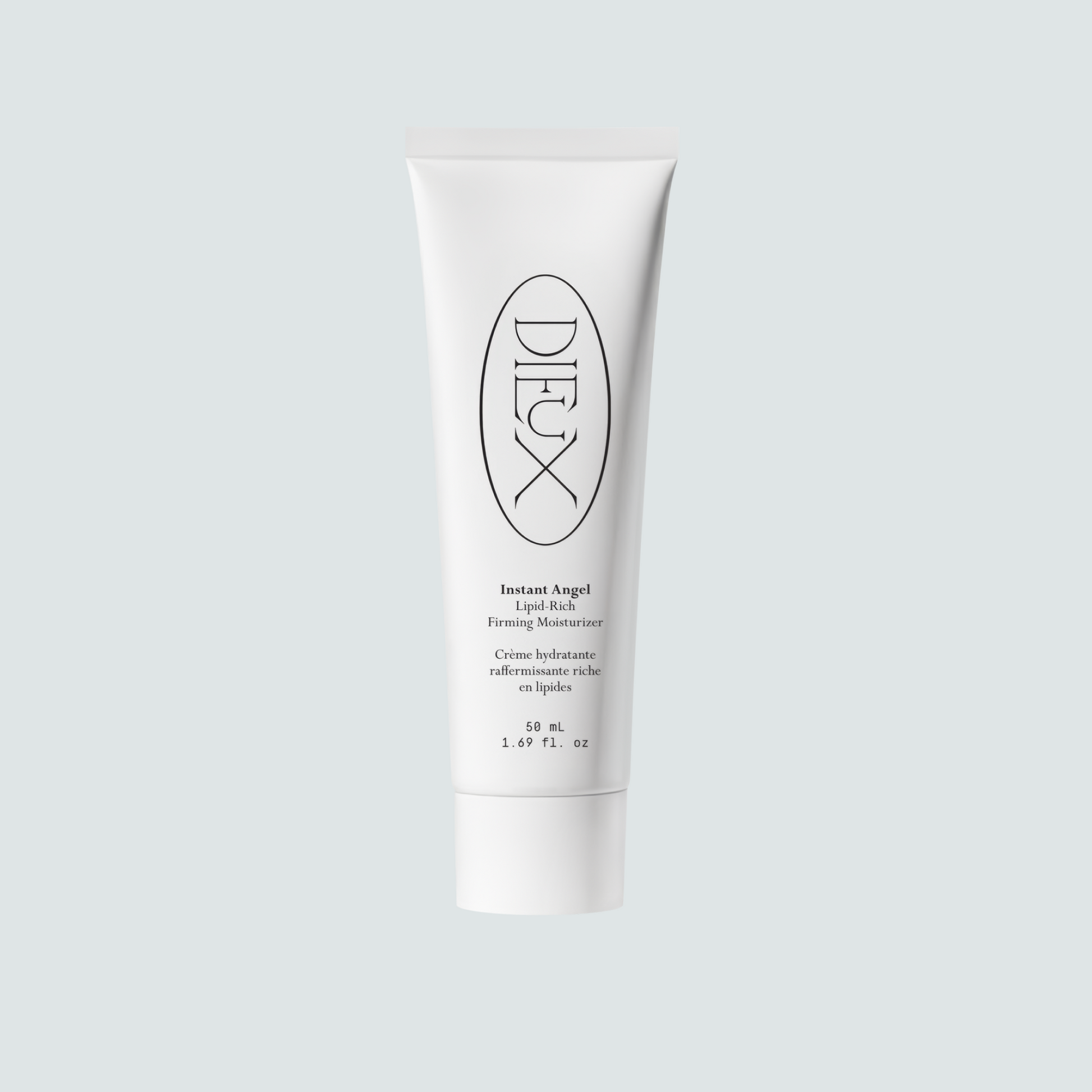 Dieux Instant Angel 50 ml moisturizer tube on a pale background