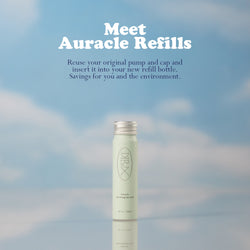 Dieux Auracle Eye Serum Refill on a blue and white cloud background,

Text: Meet Auracle Refills. Reuse your original pump and cap and insert it into your new refill bottle. Savings for you and the environment. 