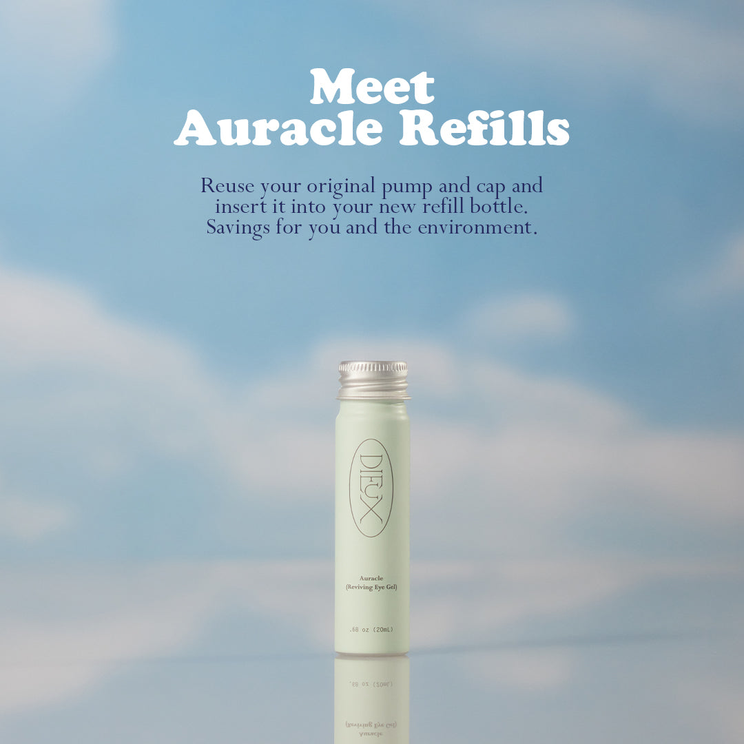 Dieux Auracle Eye Serum Refill on a blue and white cloud background,

Text: Meet Auracle Refills. Reuse your original pump and cap and insert it into your new refill bottle. Savings for you and the environment. 