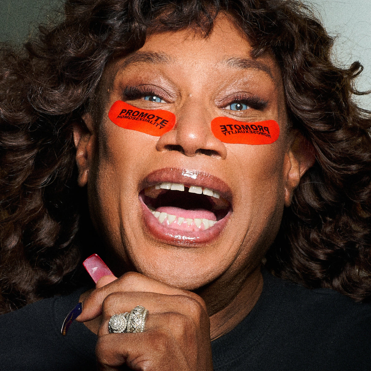 Model wearing the Dieux x Willie Norris "Promote Homosexuality" Forever Eye Mask under the eyes