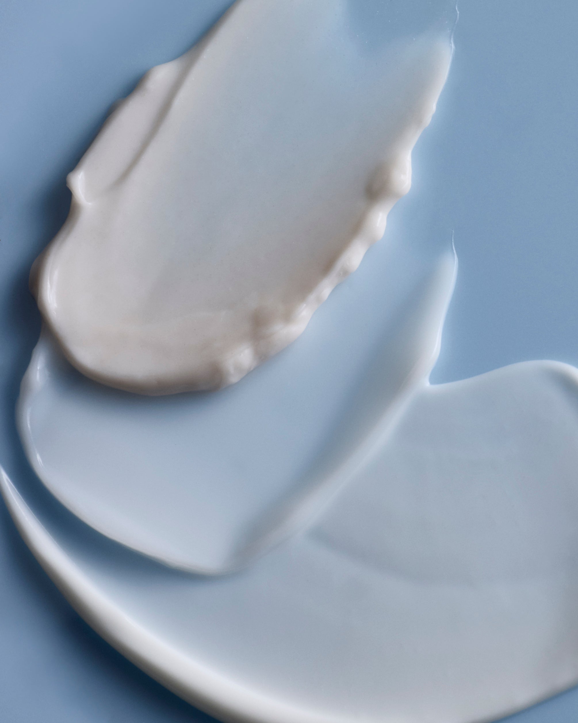 Dieux moisturizer texture layered on skin