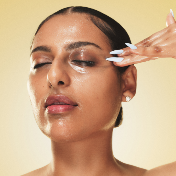 Person applying Ethereal Cleansing Oil to their face